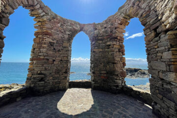Stone brick arches beside the sea